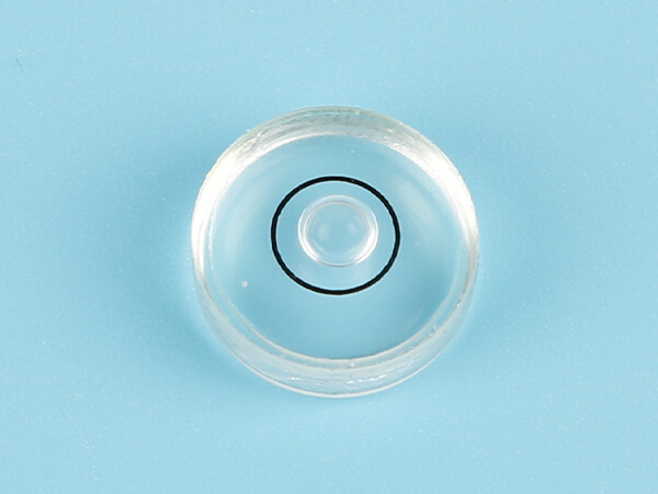 Glass circular bubble level vial has a black sight line and no tip.