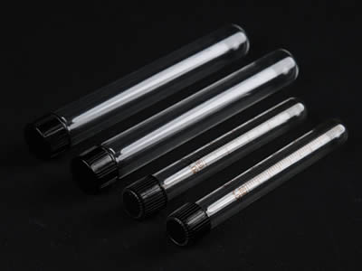 Two graduated and two smooth glass test tube on the black background.