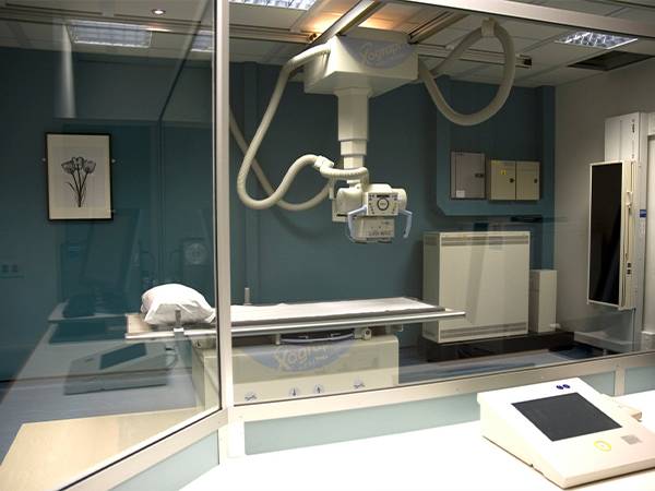 A CT scan room with transparent radiation shielding glasses